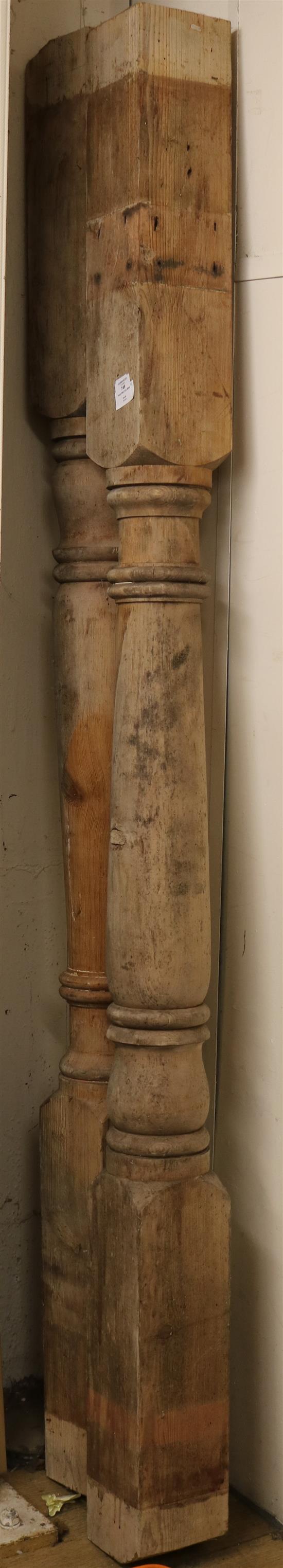 A pair of turned pine columns, H.6ft 11in.